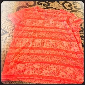 A nice orange and white shirt got from a store